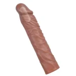 Manșon pentru penis montat, cu prelungire de aproximativ 4 cm oferită de glandul solid