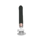 Dildo negru drept pe suport, cu cele două butoane rotunde de pe corp și banda aurie-roz