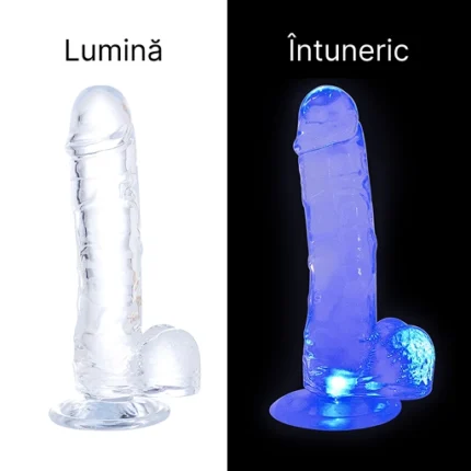 Același dildo la lumină, incolor, și la întuneric, aprins în albastru