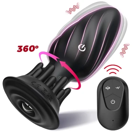 Dop anal negru din silicon, cu cap spiralat, noduli pe gât și bază rotundă, lângă telecomanda cu trei butoane
