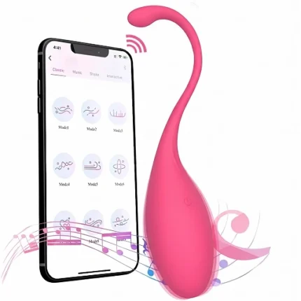 Ou vibrator roz cu coadă curbată, lângă telefonul cu modurile de vibrație din aplicație